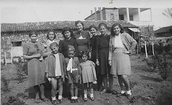 Members of the Faller and Eliades outside the Faller home in Greece. Jim and Katy are in the front.